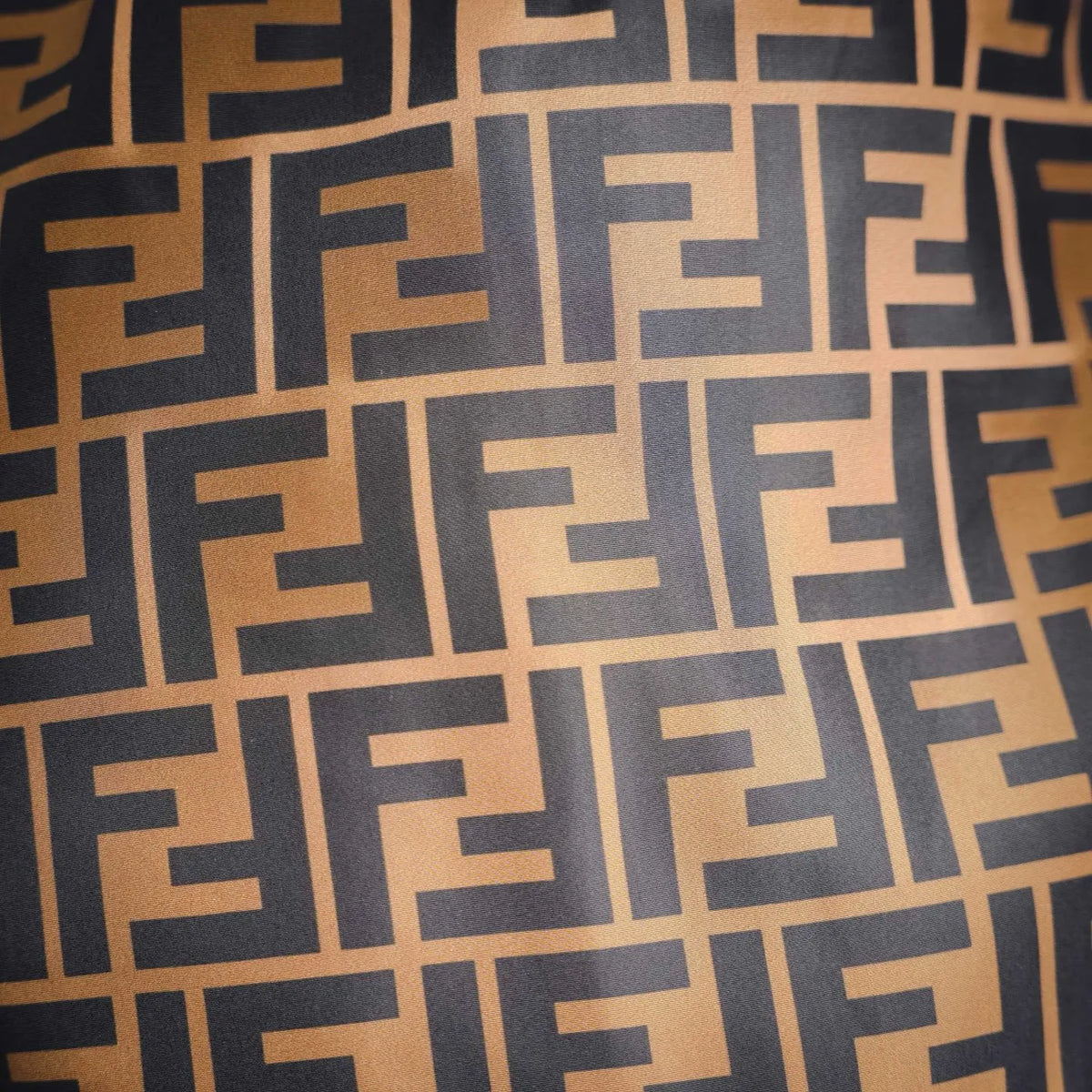 Brown and black geometric logo pattern fabric