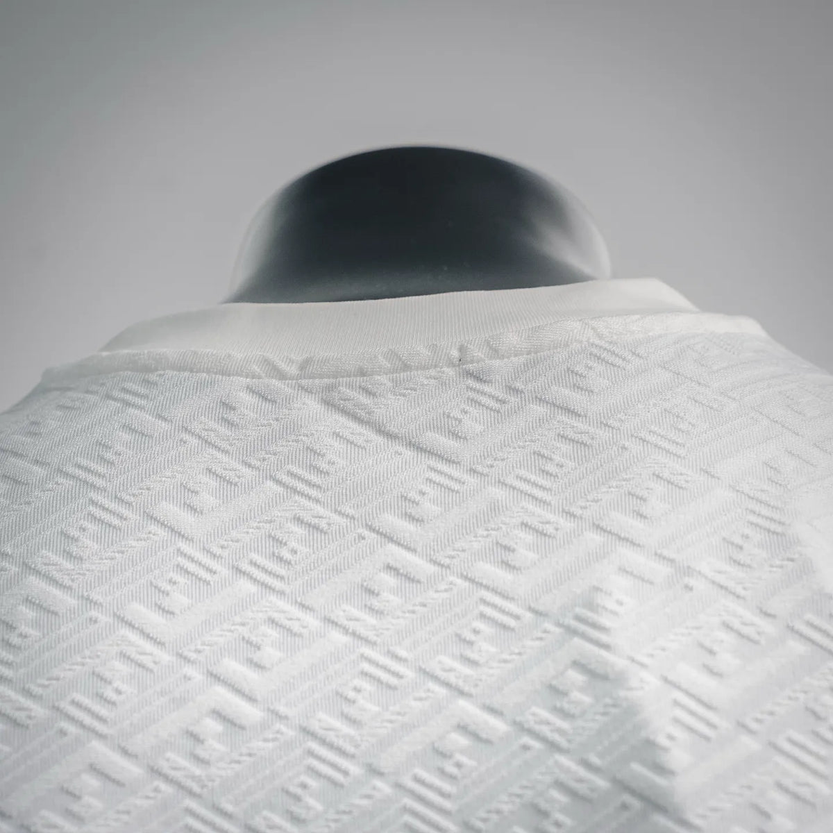 FENDI white embossed monogram T-shirt, close view of back neckline and textured fabric