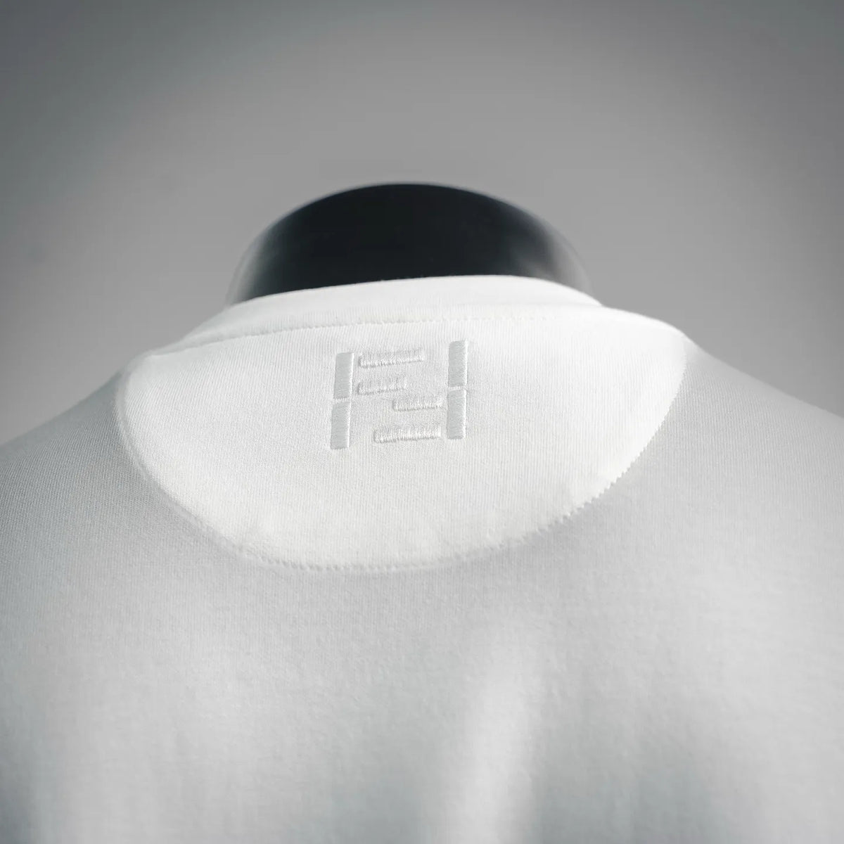 White T-shirt back with Fendi logo embroidery near the upper collar