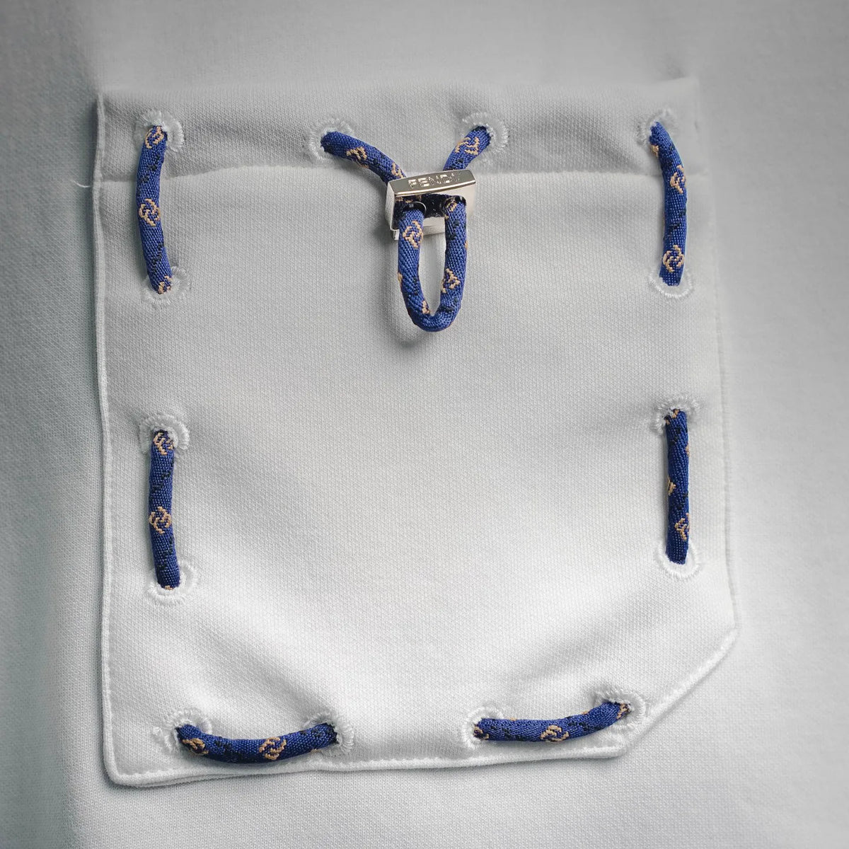 Fendi shorts pocket detail with blue drawcord loops and metal toggle