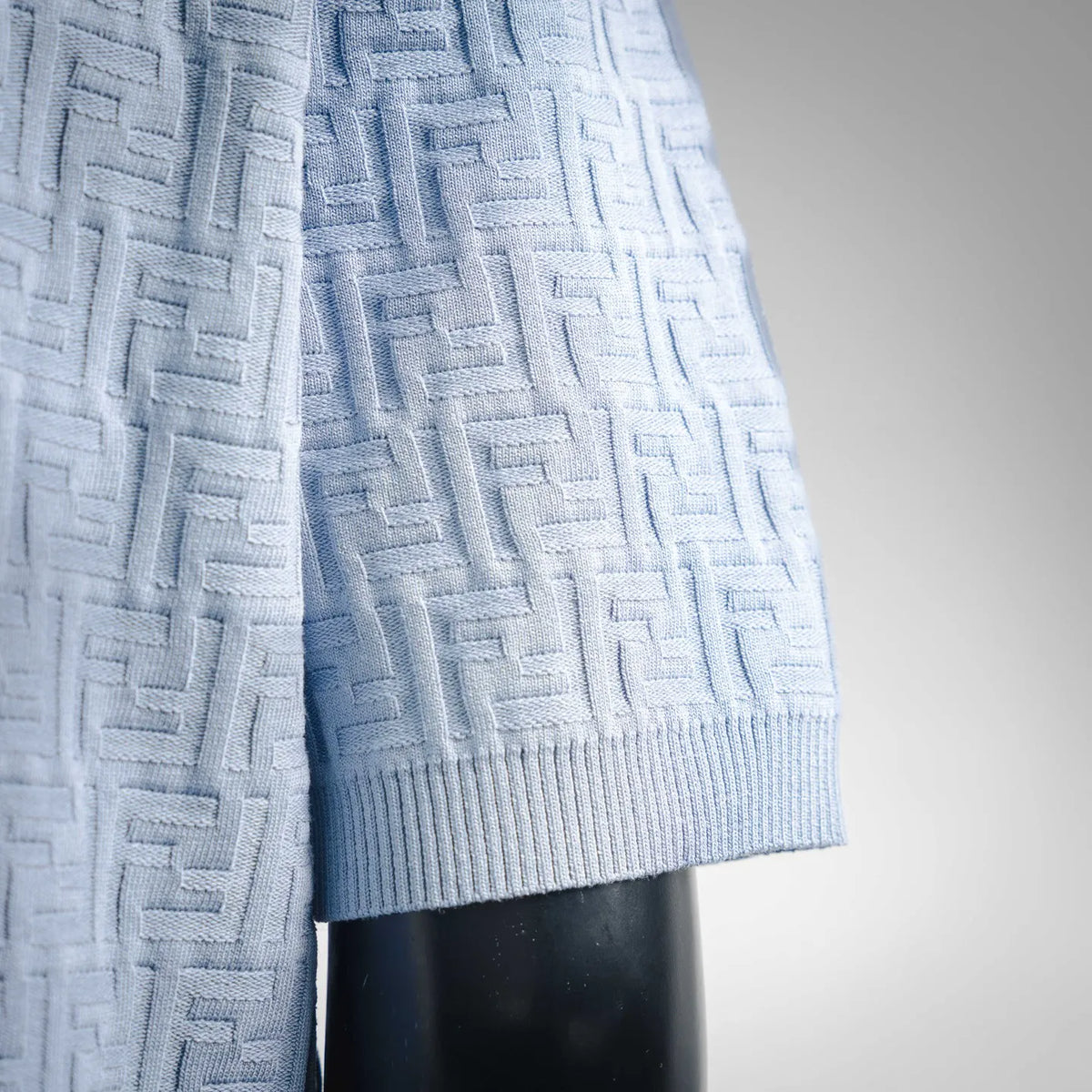 Light blue Fendi knit polo shirt side detail with ribbed hem