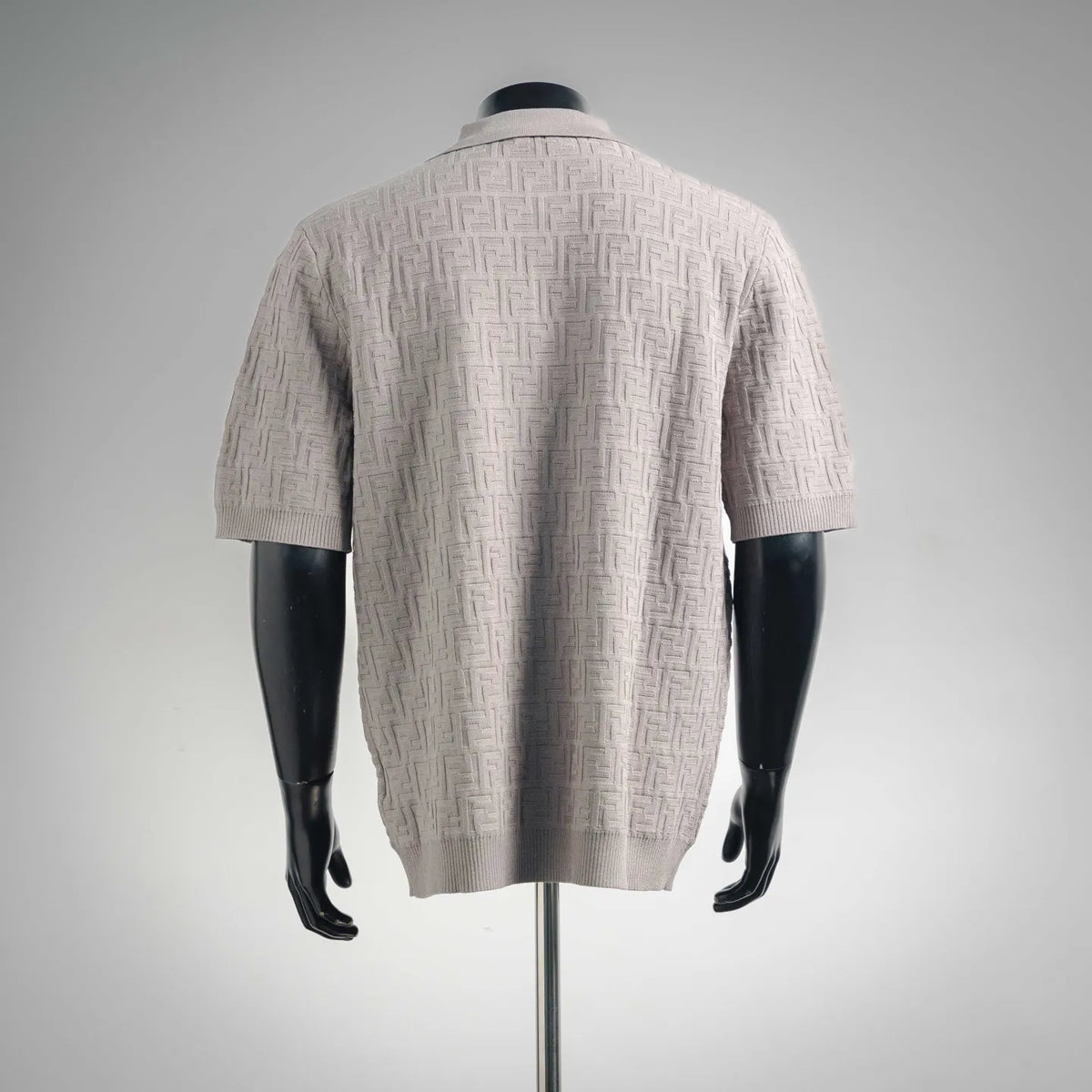Light gray knit polo shirt back view, short sleeves and ribbed hem