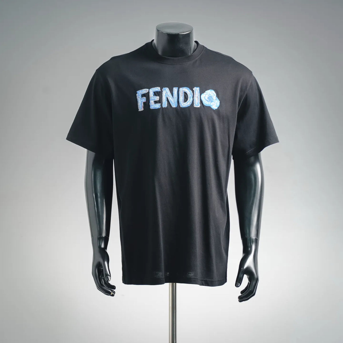 Black short-sleeve T-shirt with FENDI logo graphic on the front