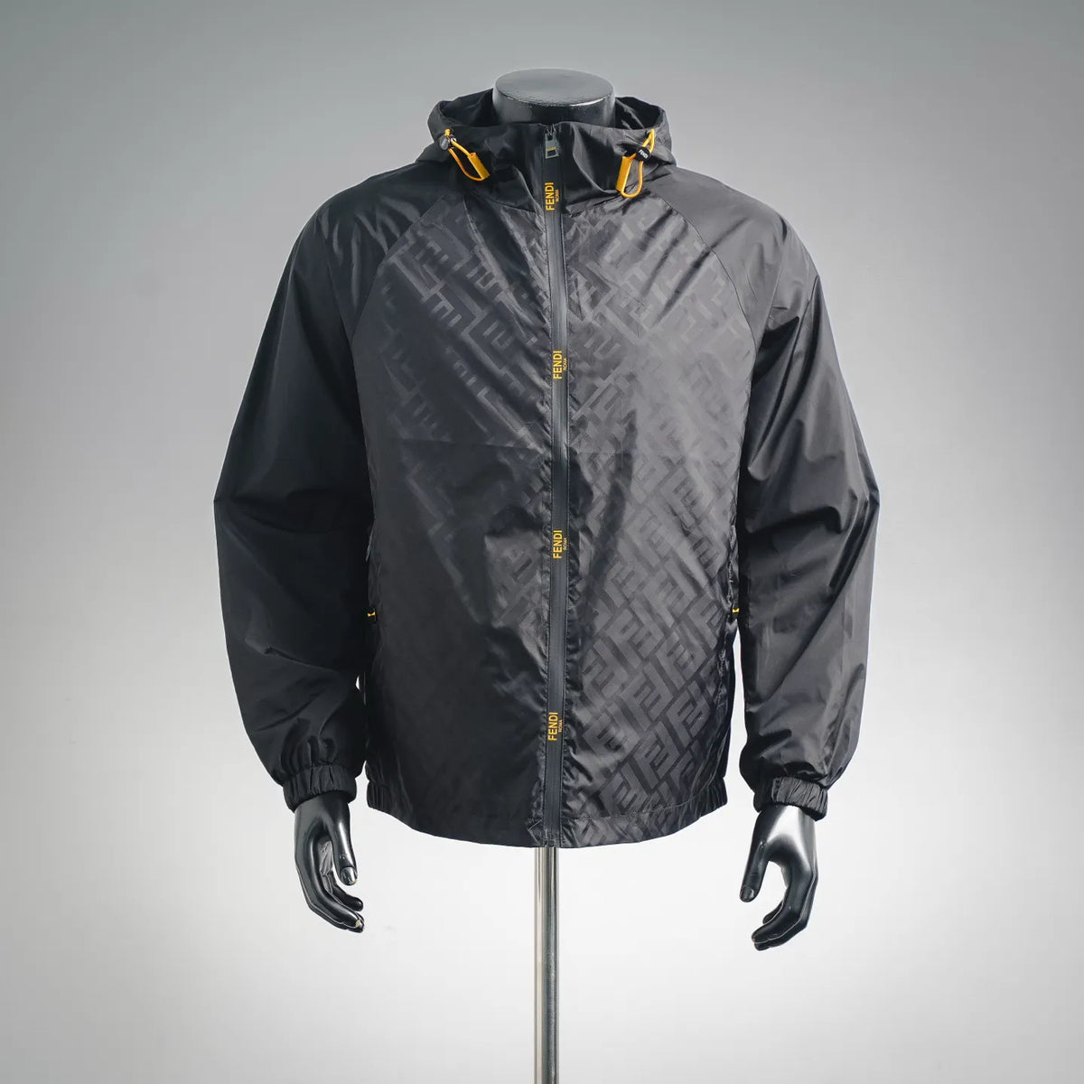Black Fendi hooded zip-up coat with allover FF pattern and yellow zipper pull