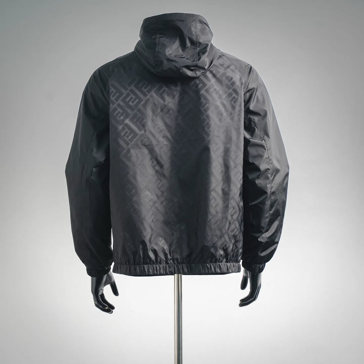 Black hooded windbreaker coat with elastic cuffs and hem, allover FF pattern