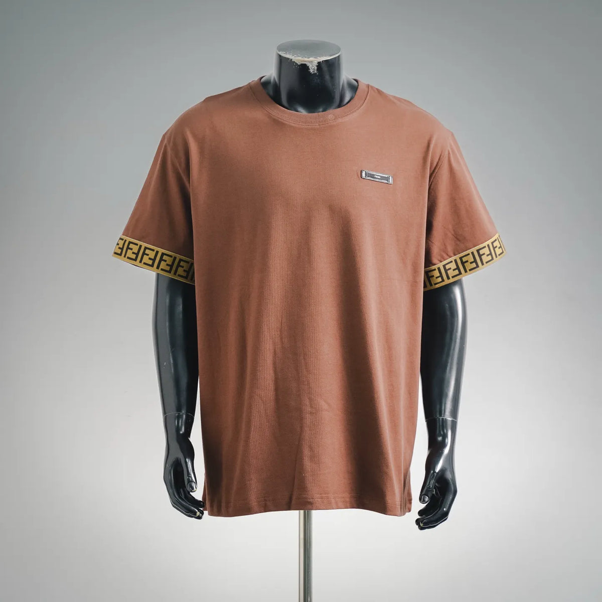 Rust brown short-sleeve T-shirt with Fendi logo patch on the chest