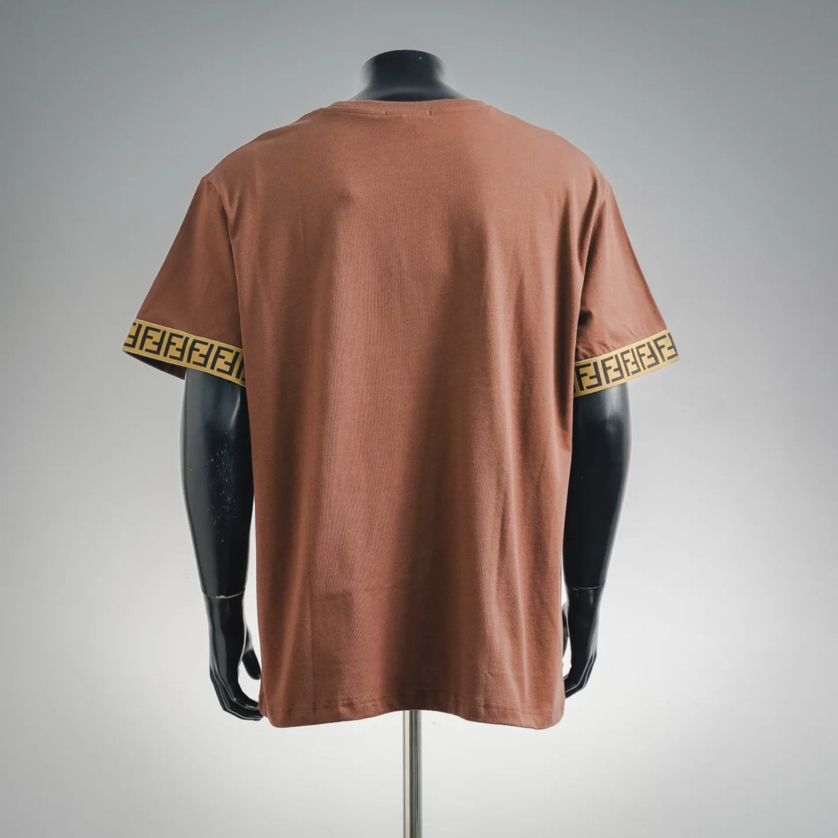 Rust brown short-sleeve T-shirt back view with Fendi logo patch and FF sleeve trim