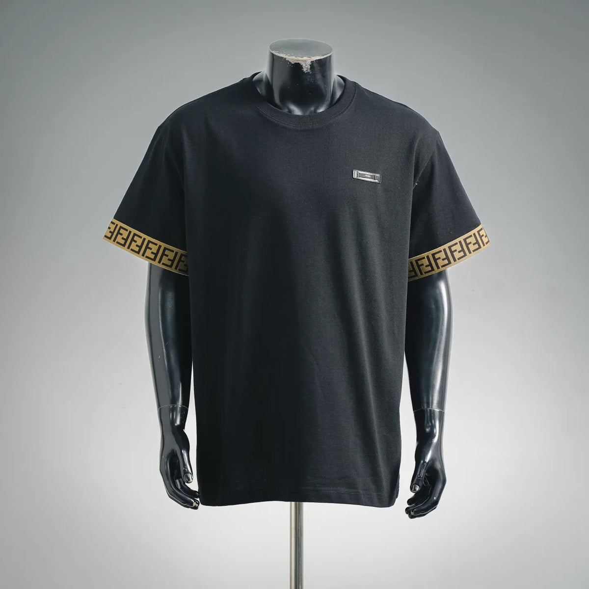 Black Fendi T-shirt with crew neck, chest label, and gold logo sleeve trim