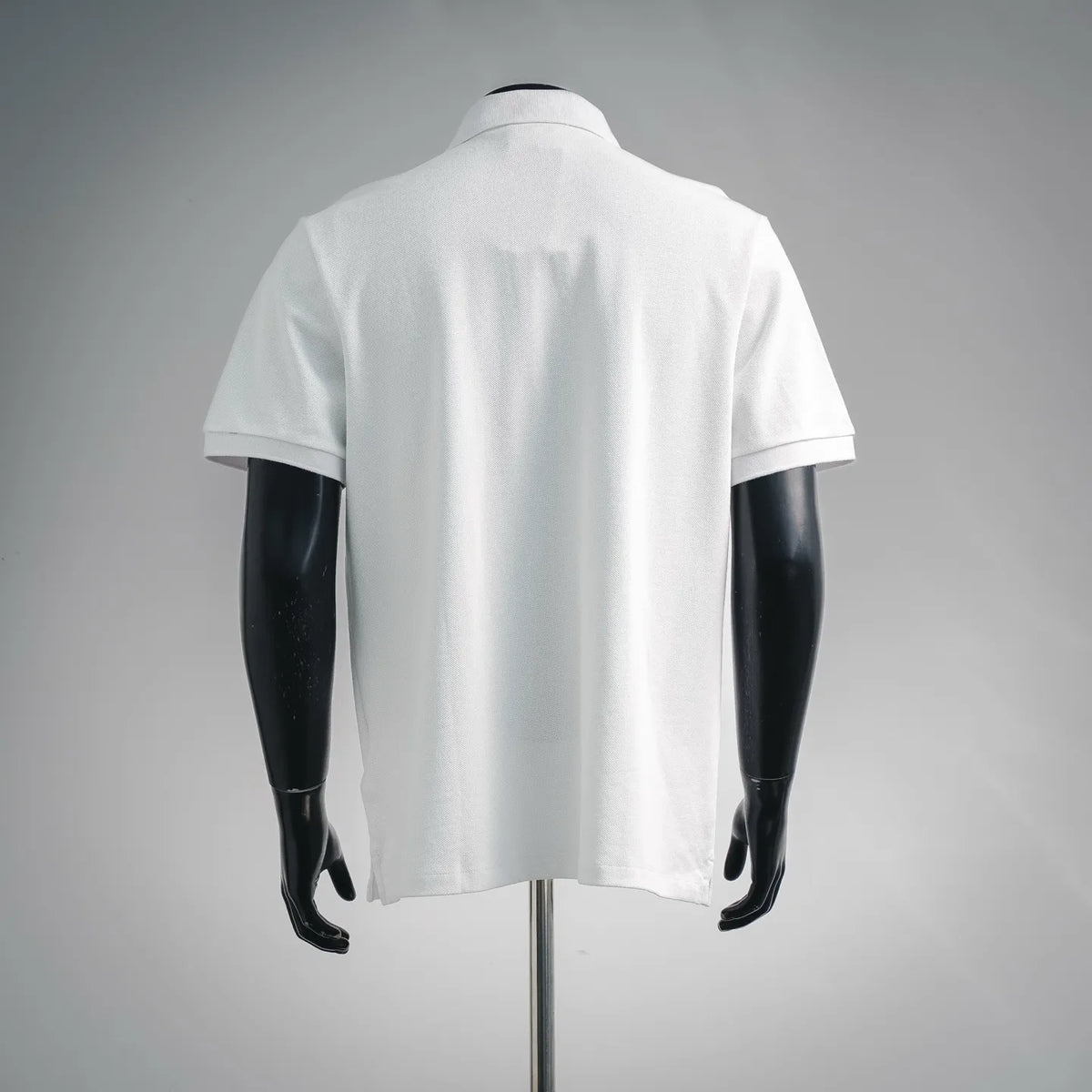 Fendi short-sleeve polo shirt, back view in white with collar and clean hemline.