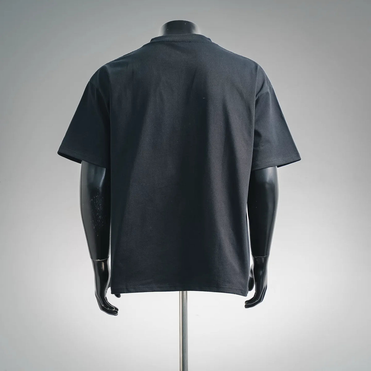 Black crew-neck T-shirt with short sleeves, rear view