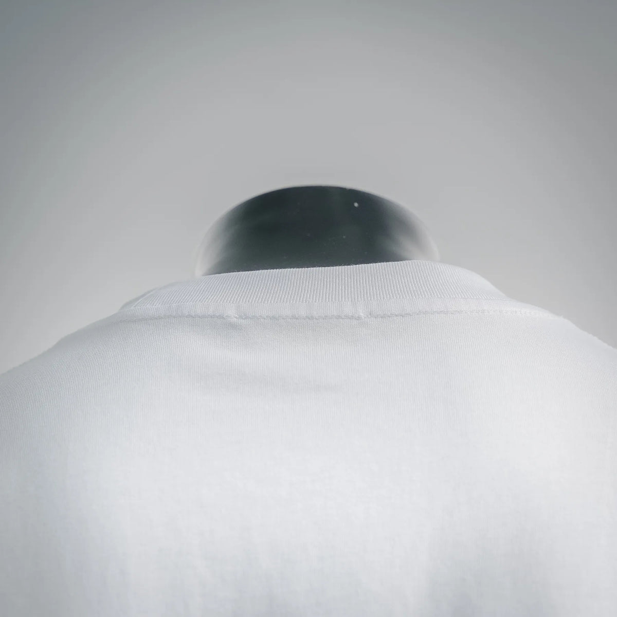 White short-sleeve T-shirt, close-up of back collar area