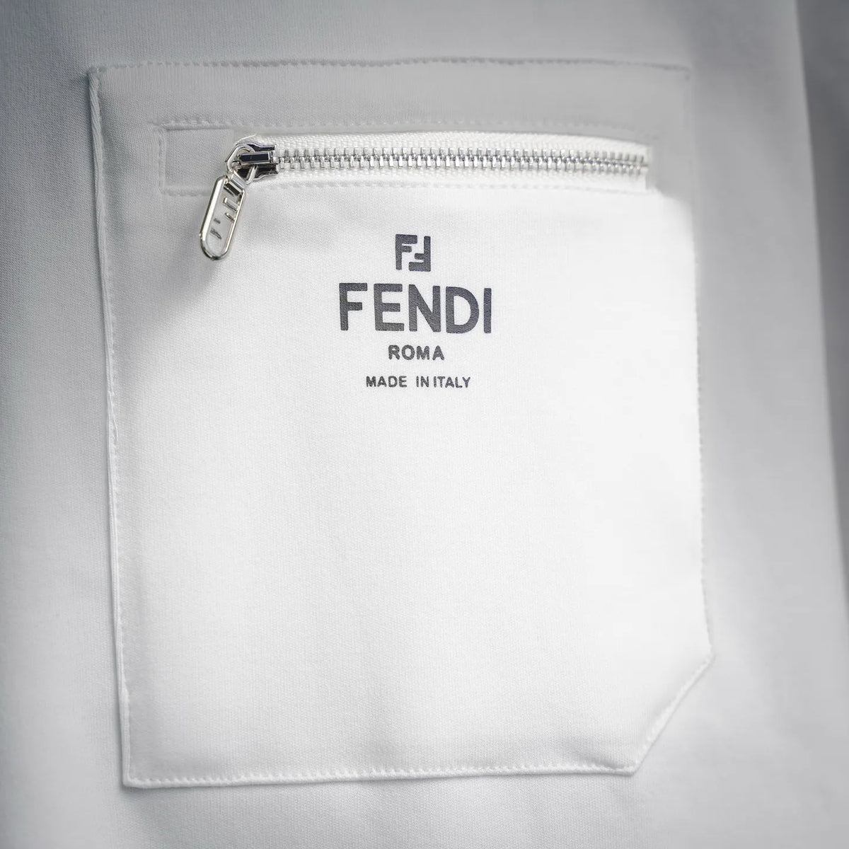 White zip chest pocket with FENDI ROMA logo patch