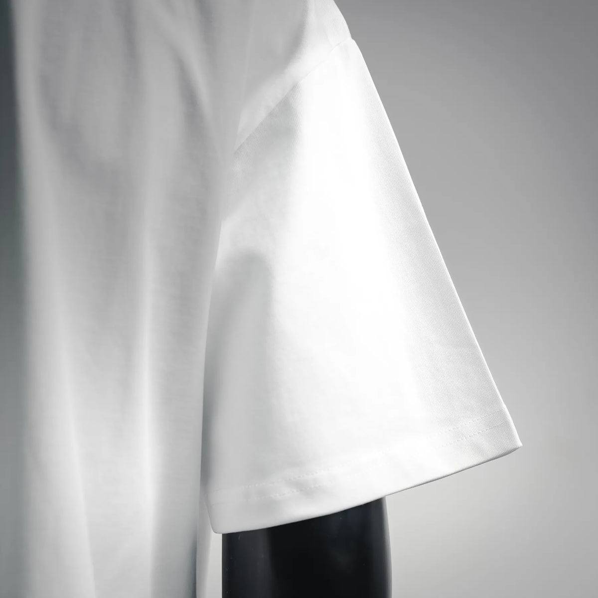 White short-sleeve T-shirt sleeve with smooth fabric drape