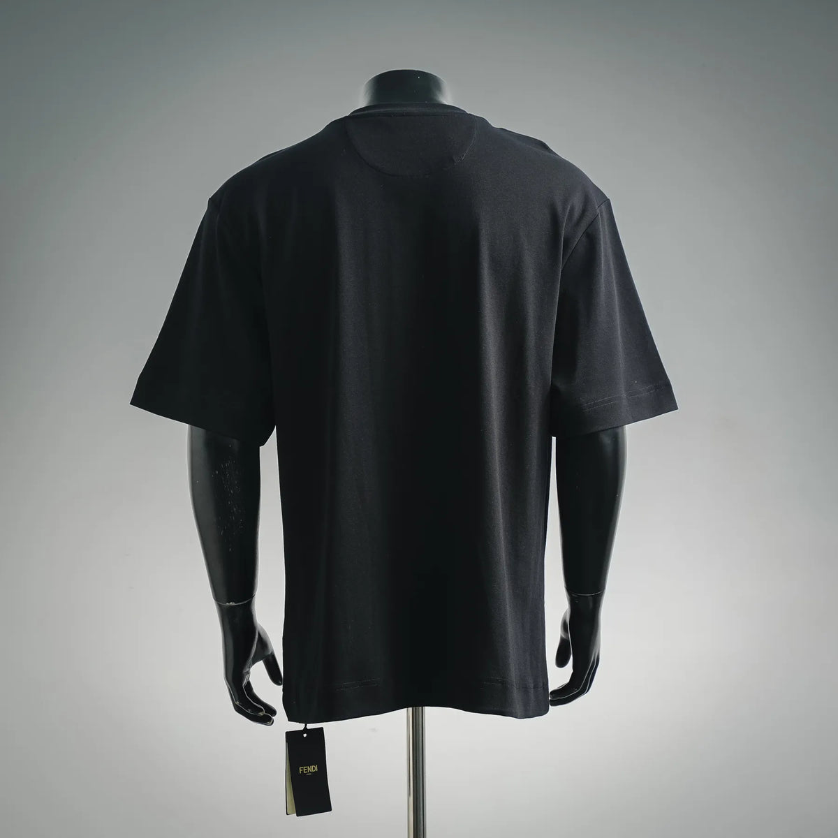 Black Fendi crew-neck T-shirt on a mannequin, short sleeves and straight hem