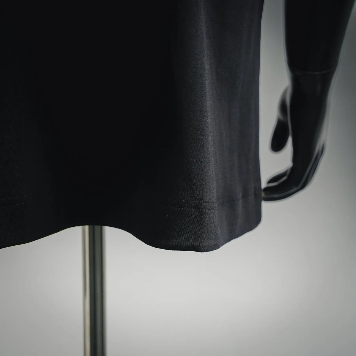 Black Fendi T-shirt lower hem and side profile with clean stitched finish