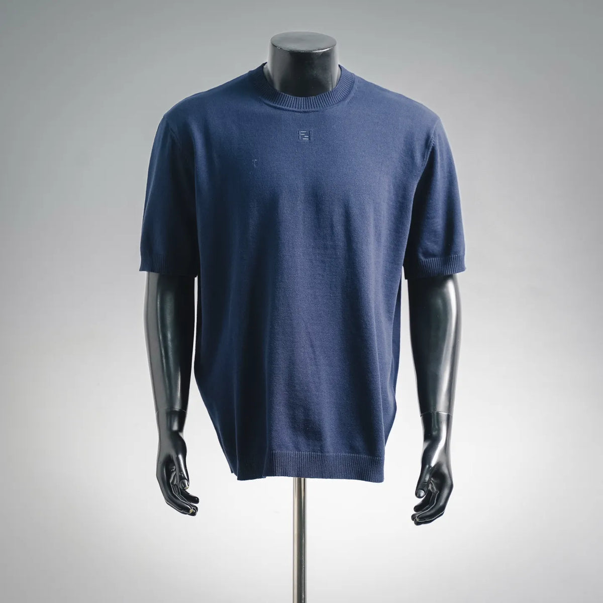 Navy knit crewneck short-sleeve sweater with small Fendi logo at chest