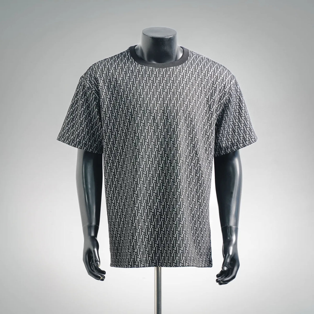 Short-sleeve knit top with repeating FF pattern in dark and light gray, crew neck.