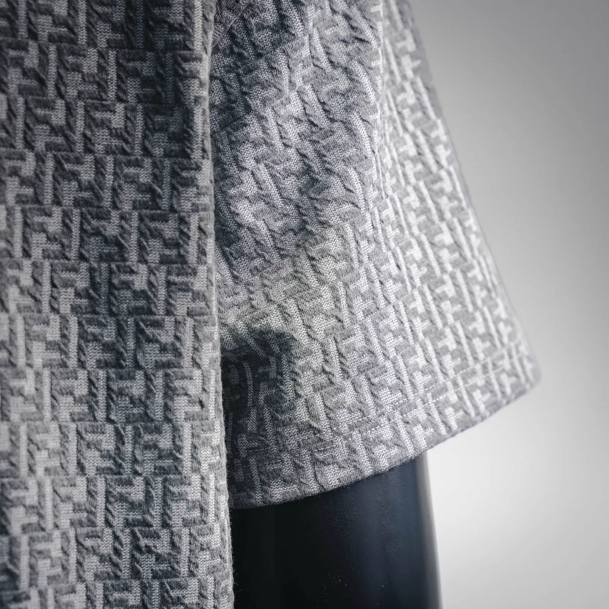 Fendi short-sleeve T-shirt fabric close-up with woven monogram texture