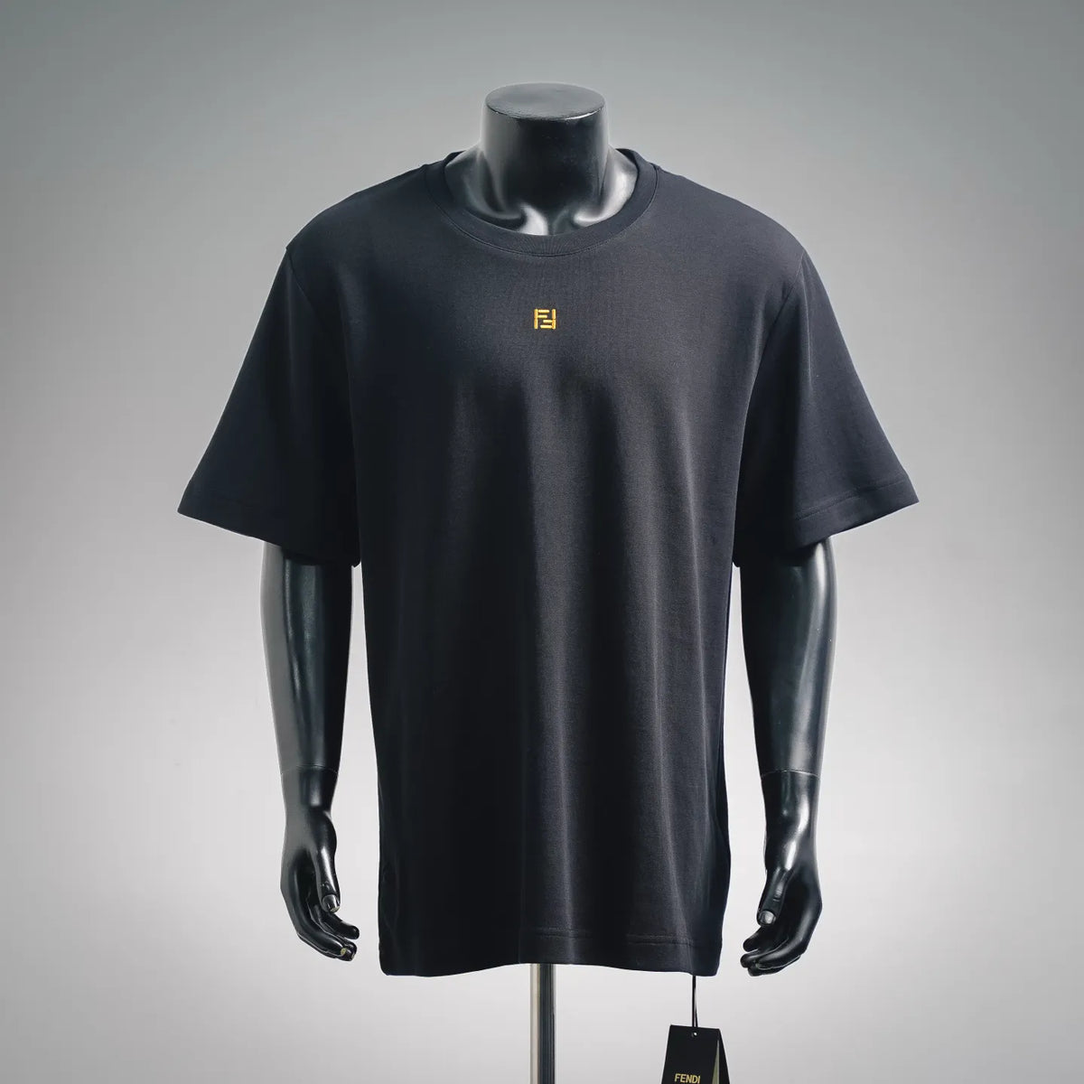 Men's black crew-neck short-sleeve T-shirt with small yellow Fendi logo on chest