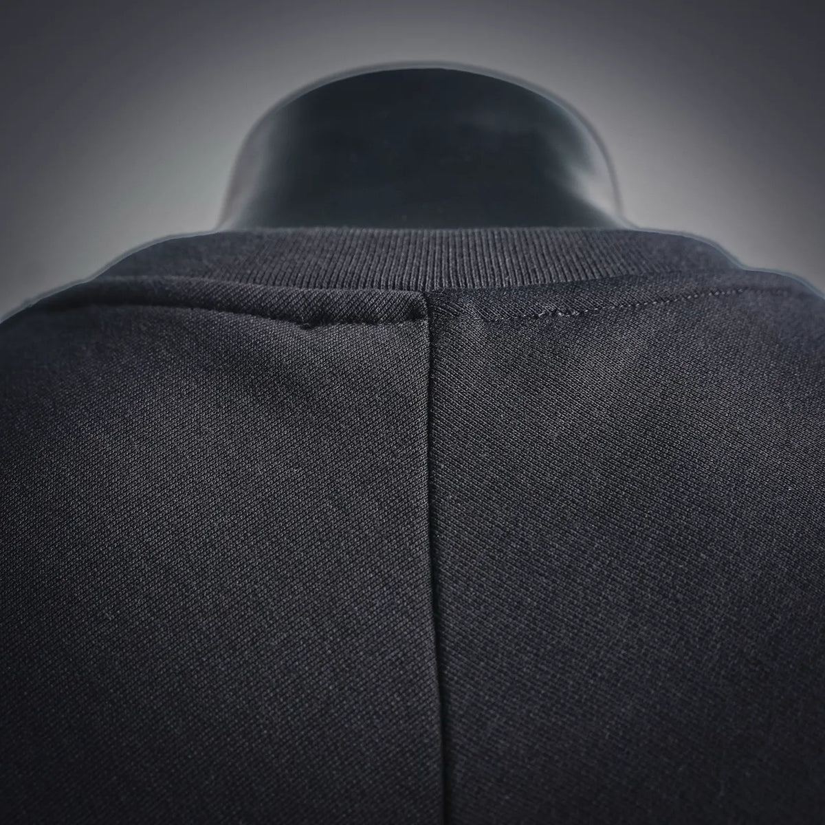 Black sweatshirt shoulder and back yoke seam with ribbed collar