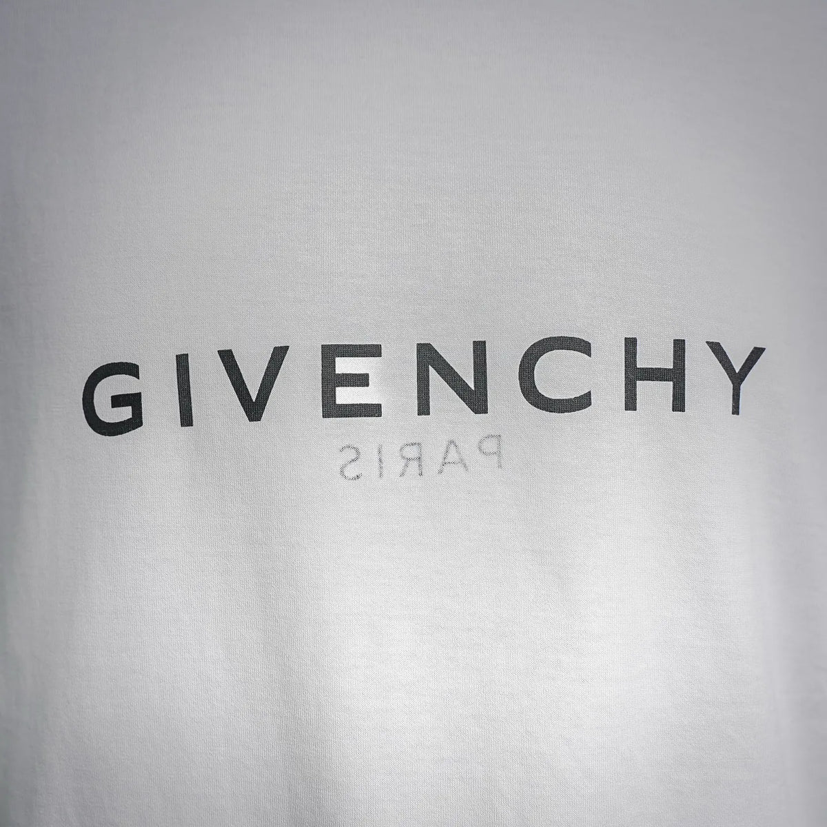 White Givenchy T-shirt front logo text: GIVENCHY