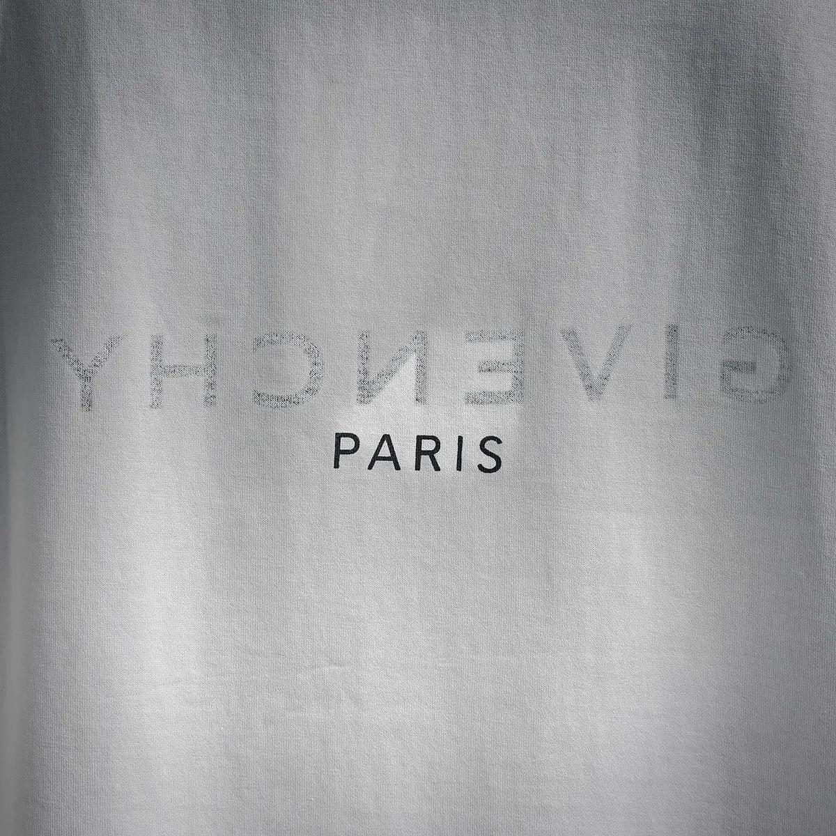 White Givenchy T-shirt back logo text: GIVENCHY PARIS