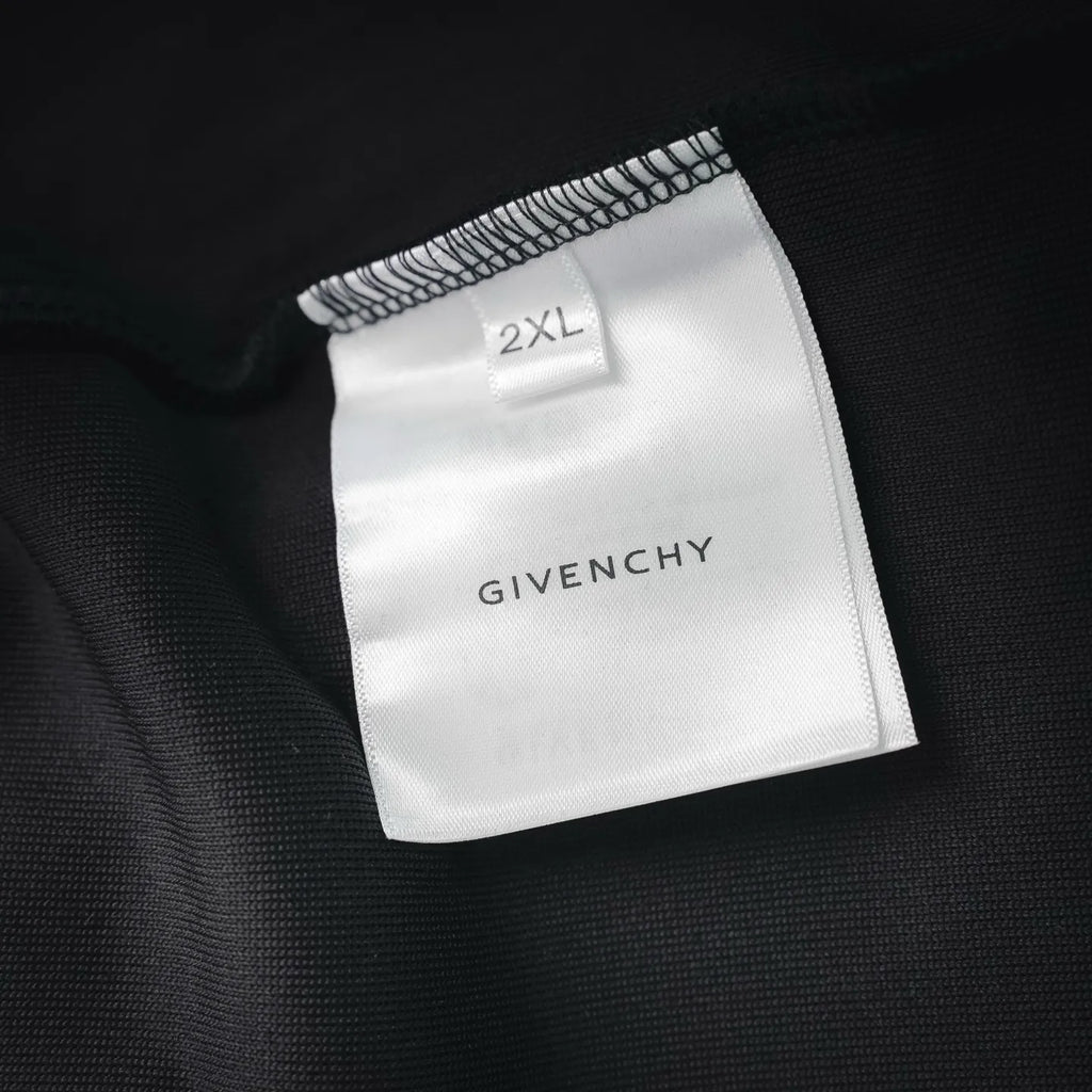2XL size label and Givenchy branding on black sweatshirt fabric