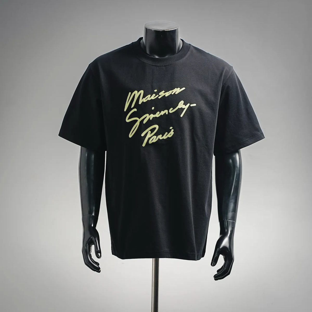 Black short-sleeve T-shirt with yellow script logo on the chest