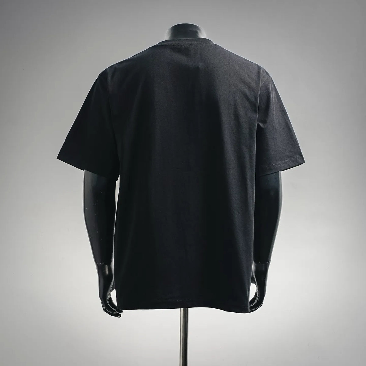 Black short-sleeve T-shirt on a mannequin, back view