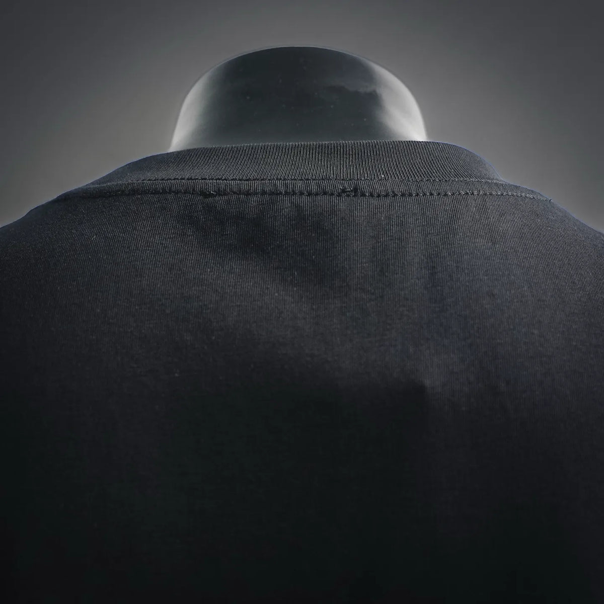 Black crewneck T-shirt collar seam close-up