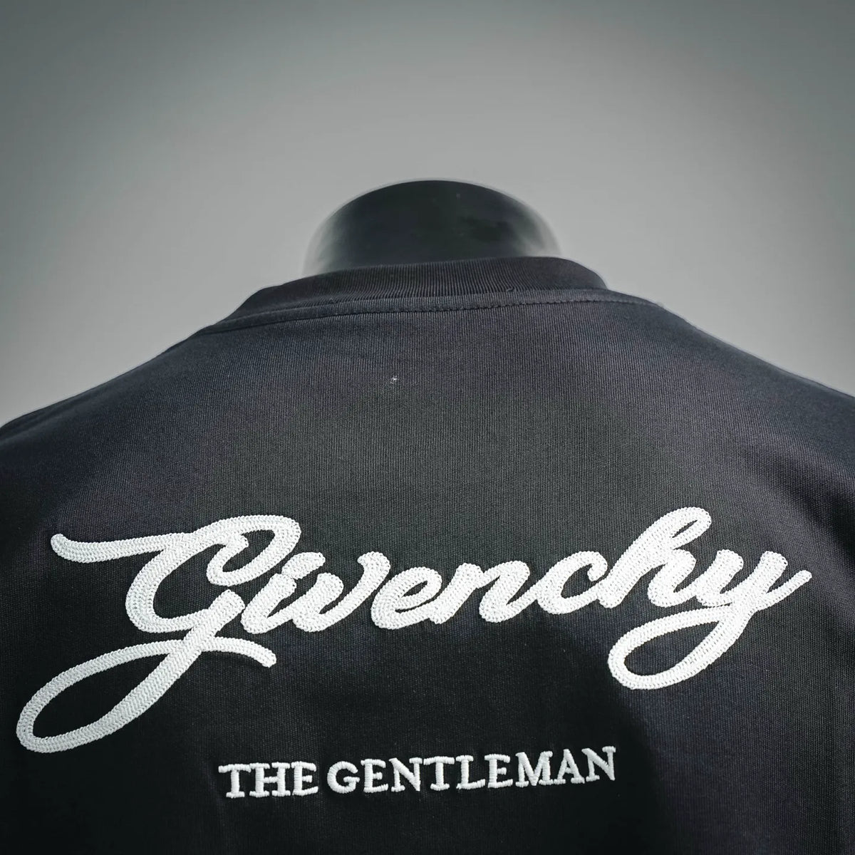 Black crewneck T-shirt with large script Givenchy logo on the back