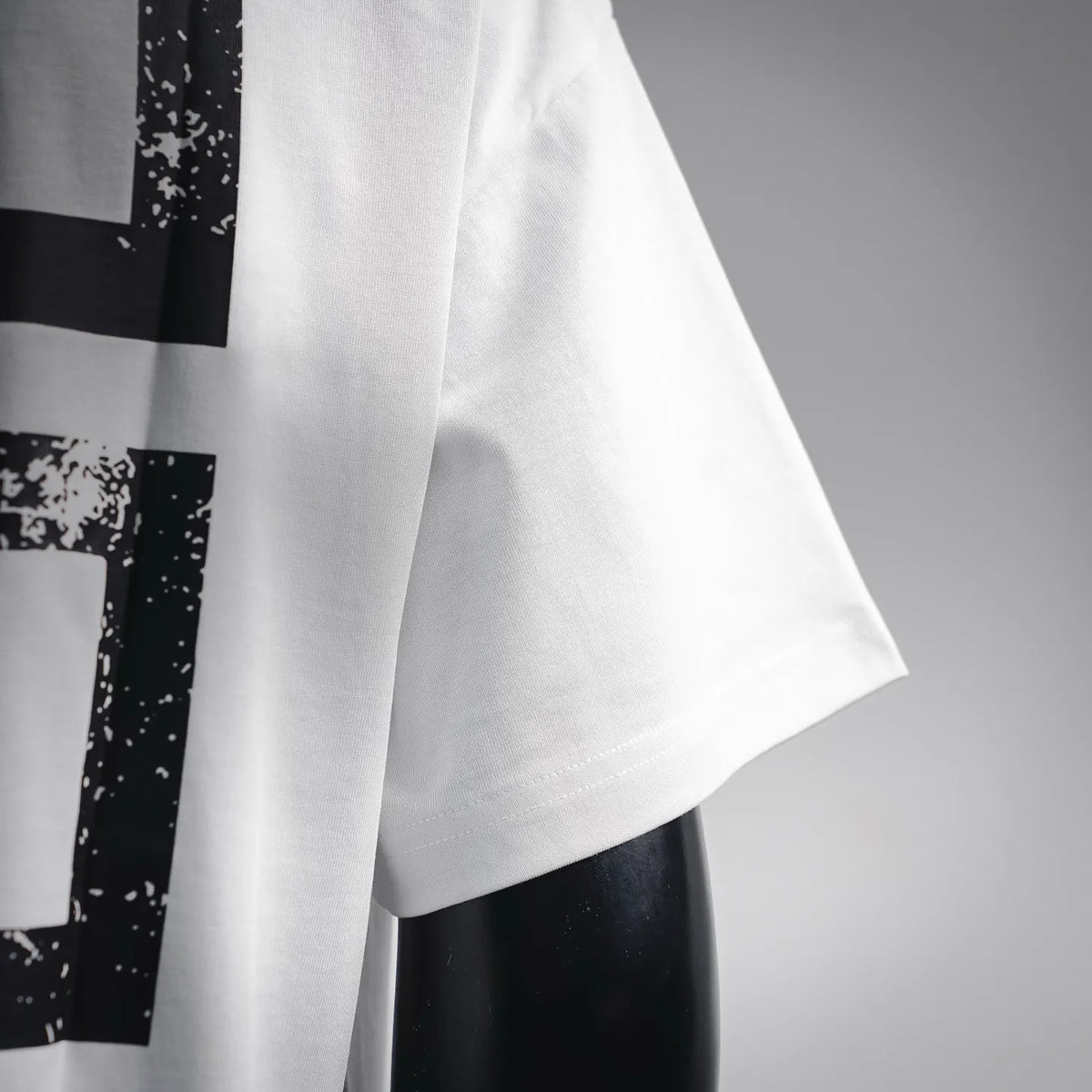 White T-shirt sleeve and hem with black abstract cross print