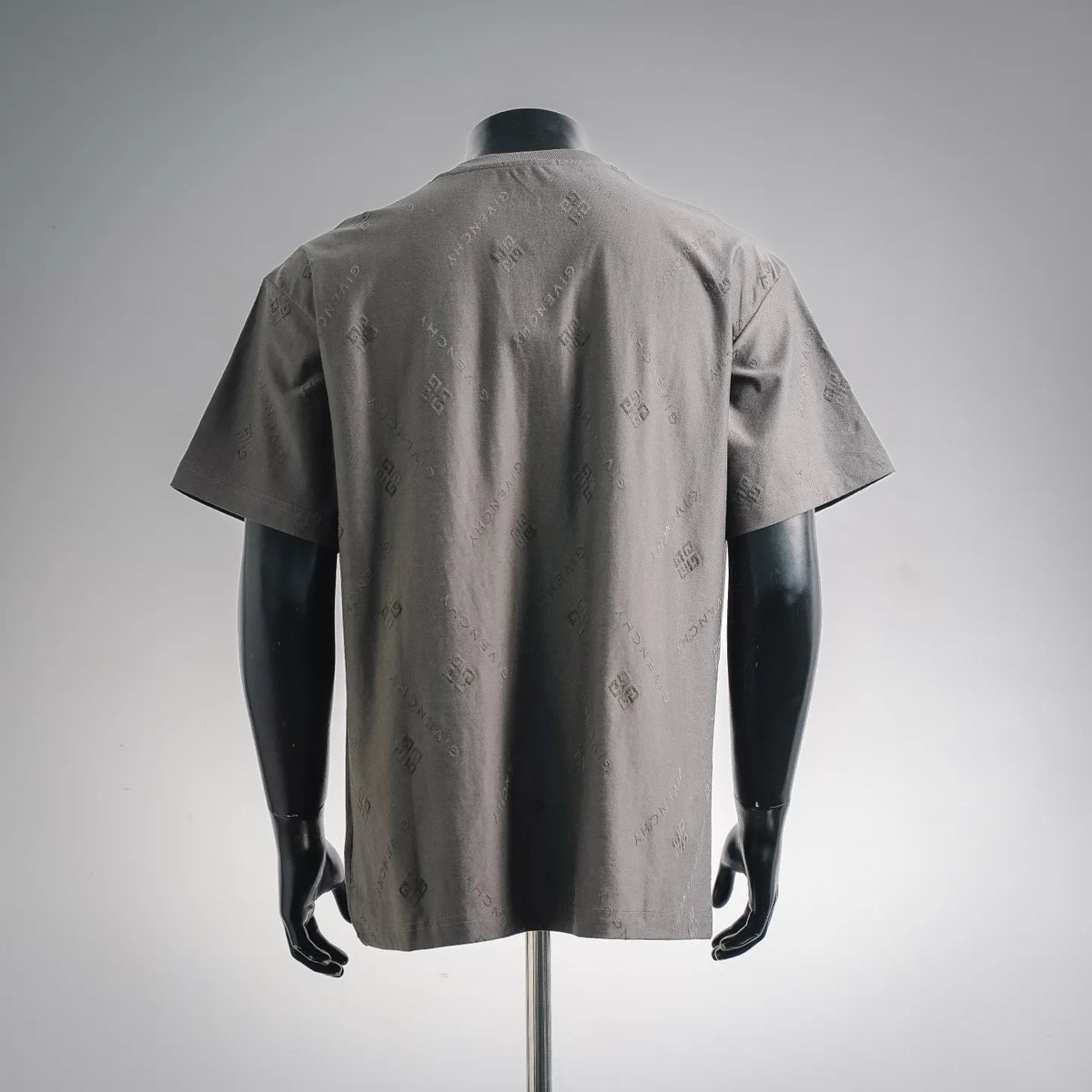 Gray short-sleeve crewneck T-shirt back view on a mannequin, with allover logo print.