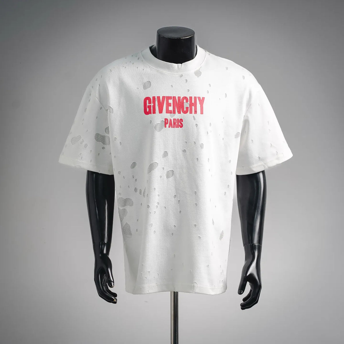 White short-sleeve T-shirt with red Givenchy Paris logo and allover distressed spots