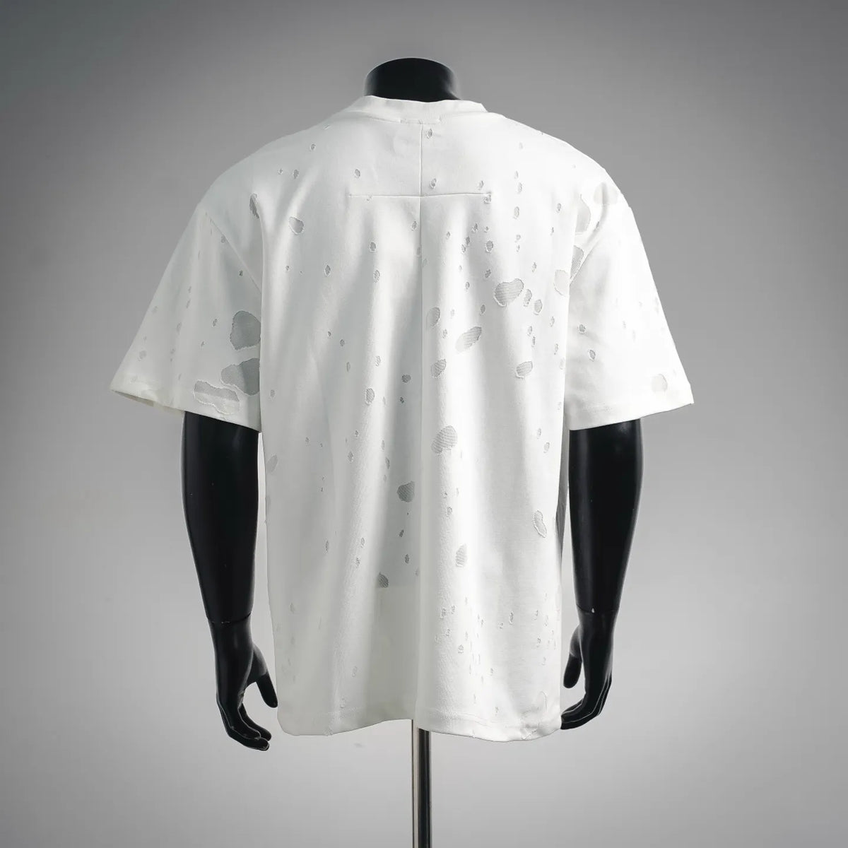 White short-sleeve T-shirt back with allover distressed dots and crew neck seam