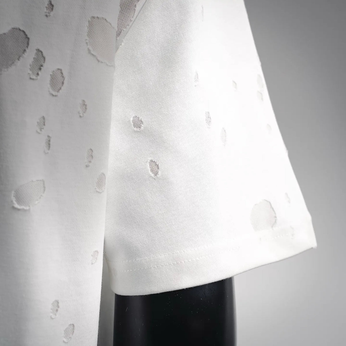 White T-shirt side panel with allover distressed spots
