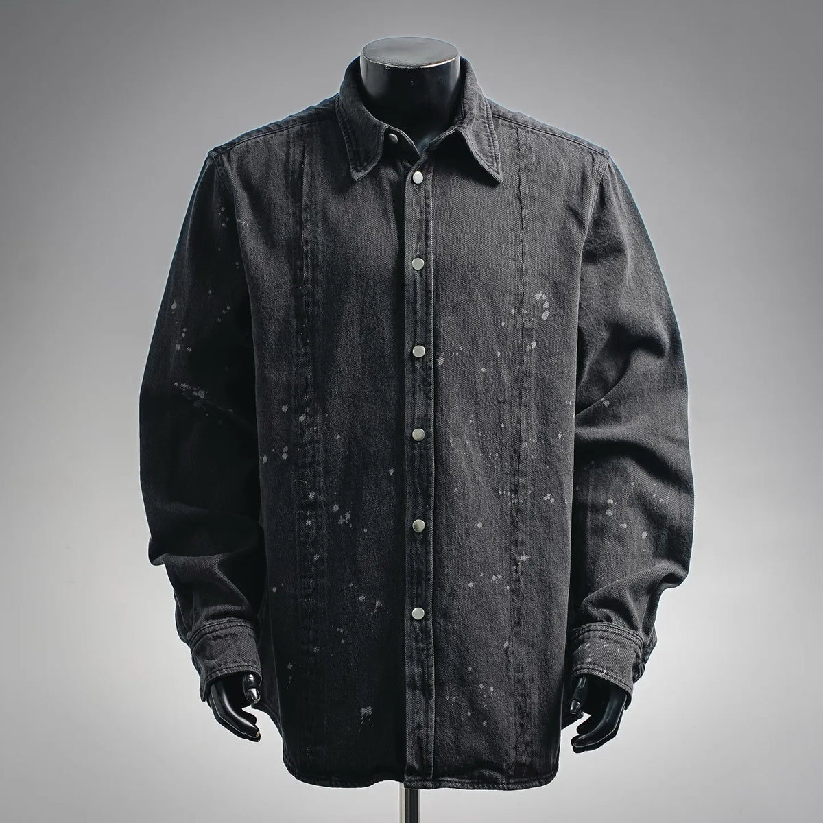 Black long-sleeve denim button-up shirt with pointed collar and front button placket