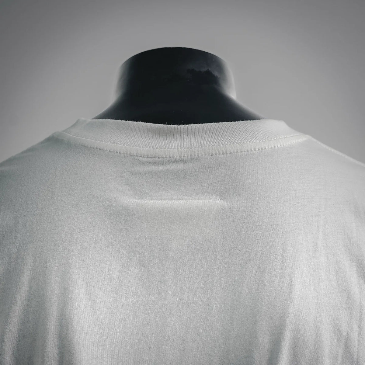 White T-shirt back neckline with crew collar and subtle seam texture