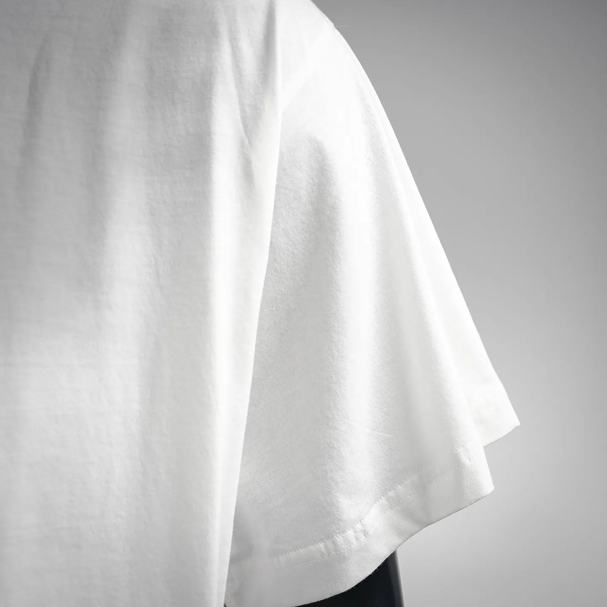White T-shirt short sleeve hem with smooth fabric drape