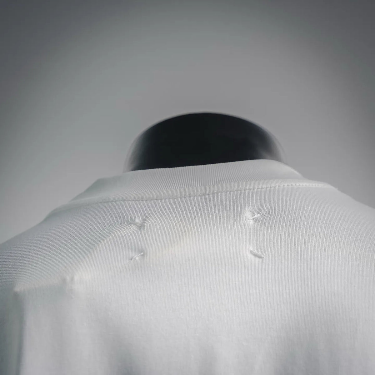 Maison Margiela white T-shirt back with stitched shoulder detail and small fabric tucks