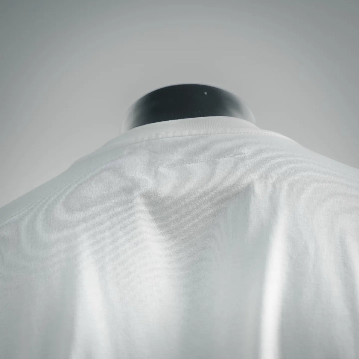 White T-shirt shoulder and upper back fabric close-up