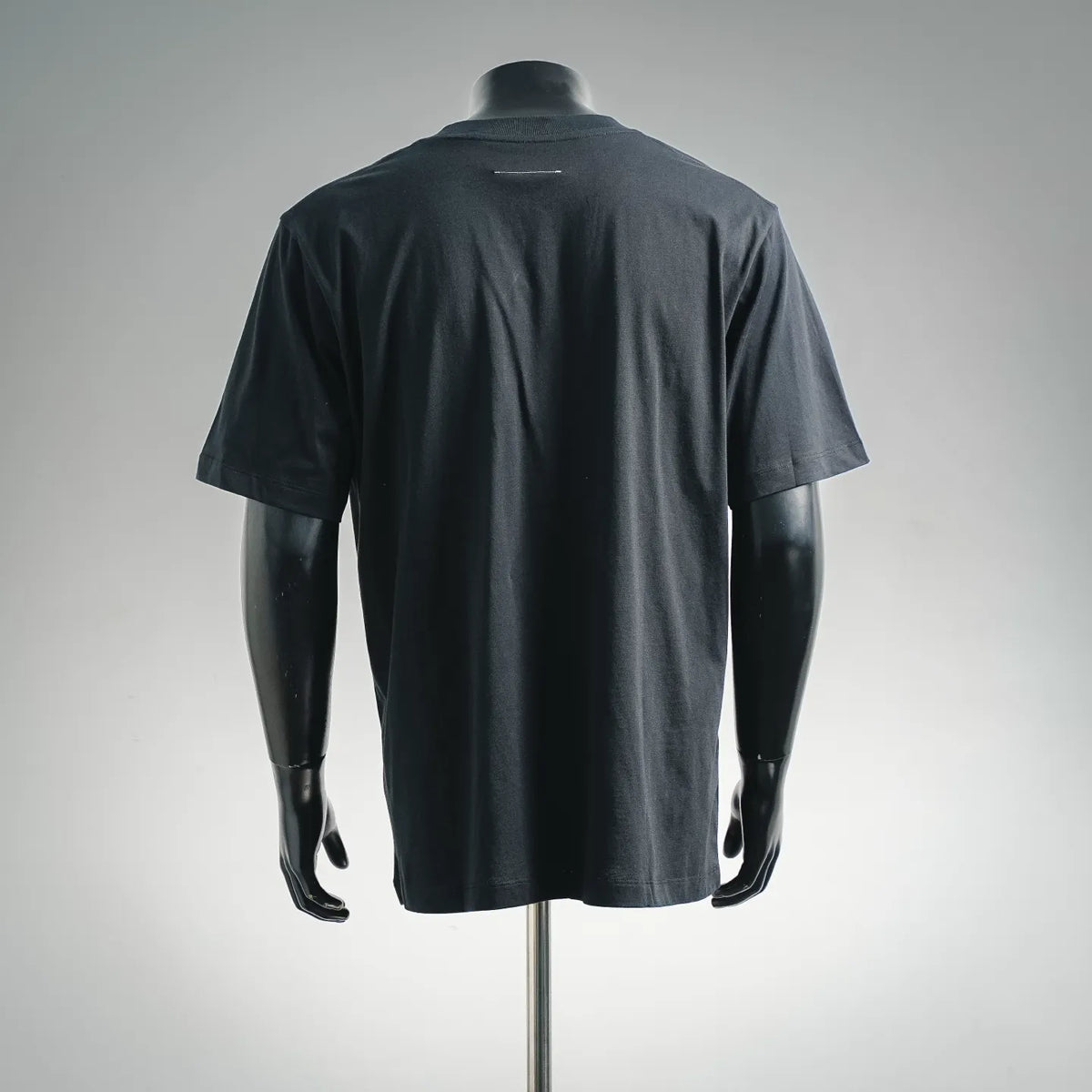 Dark short-sleeve crewneck T-shirt, plain back view on a mannequin
