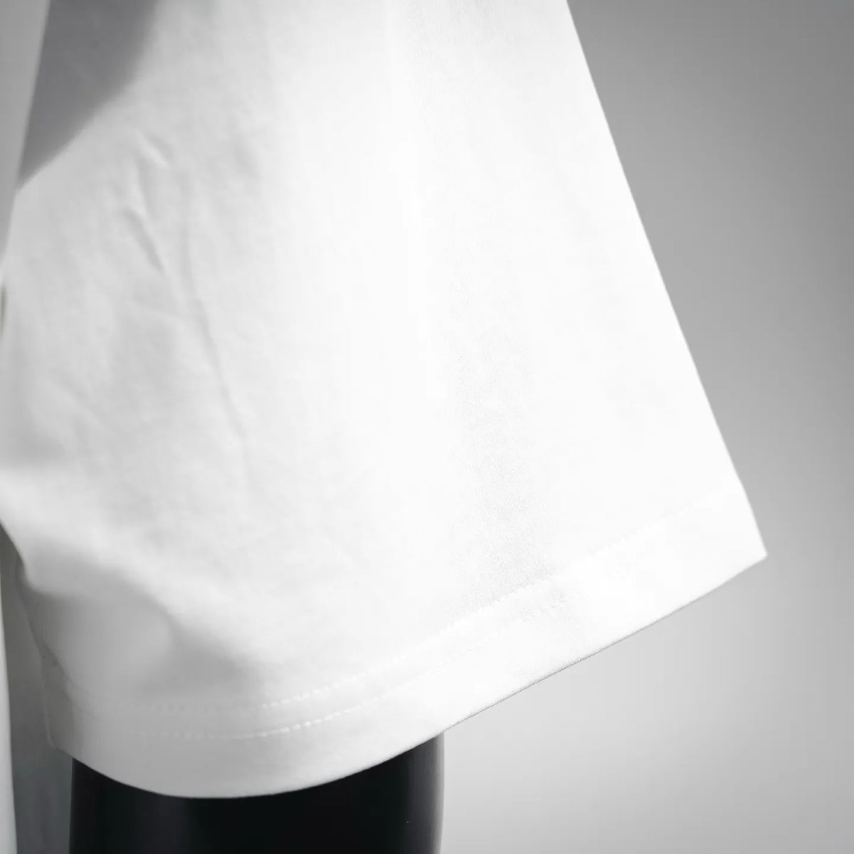 White T-shirt fabric and side seam close-up