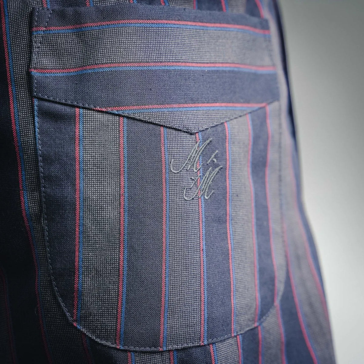 Maison Margiela striped pants front pocket with stitched logo patch and contrast lining