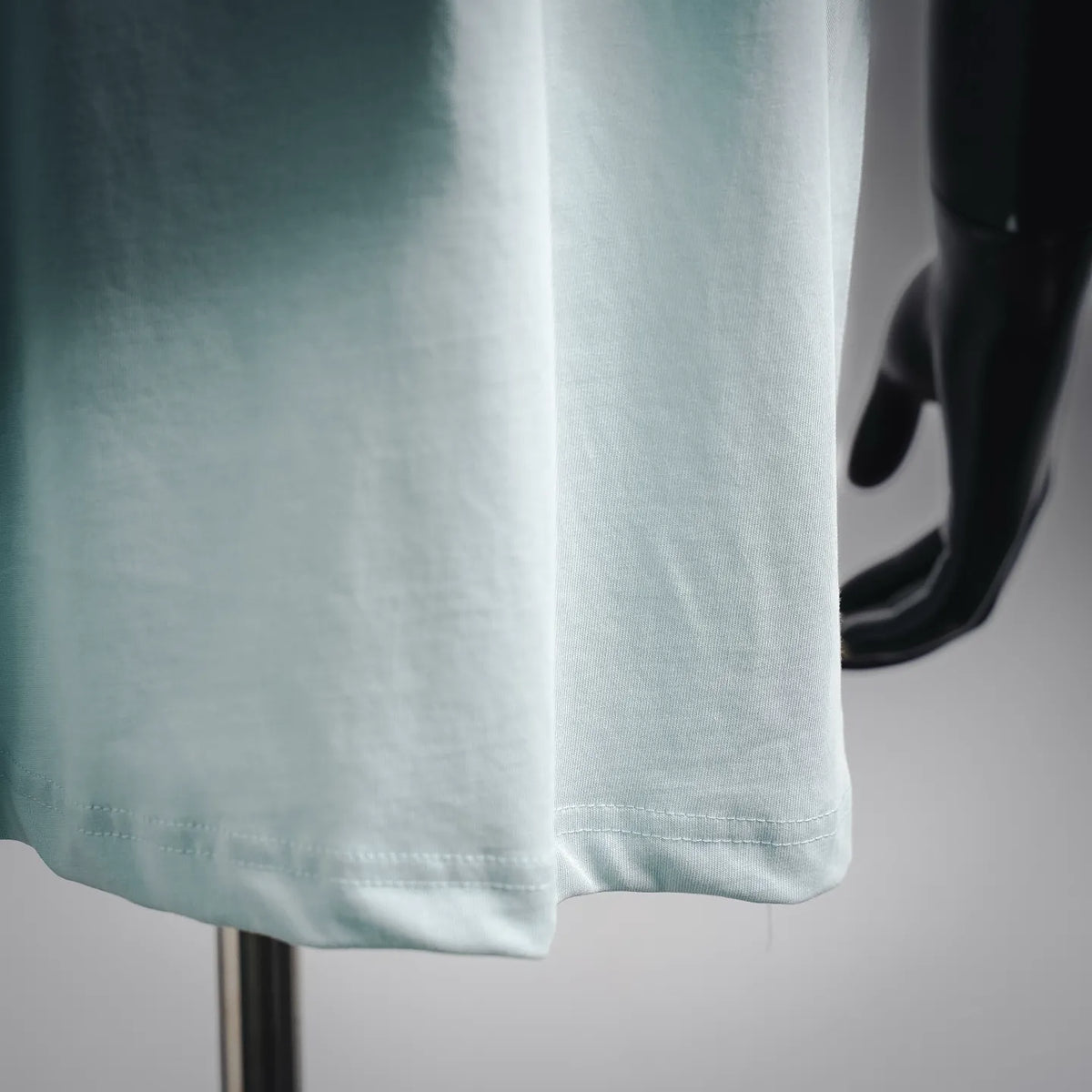 Light blue T-shirt hem with printed number graphic