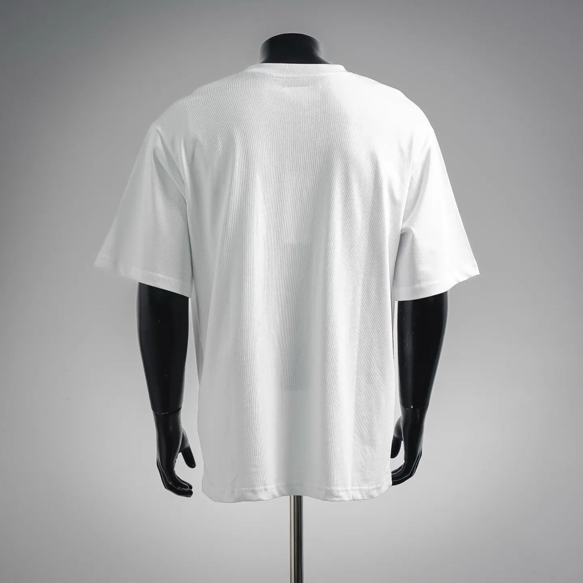 Back view of white crewneck T-shirt on a mannequin