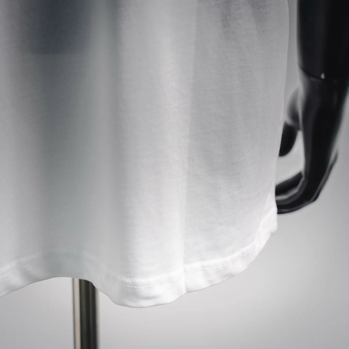 White T-shirt hem and side seam detail
