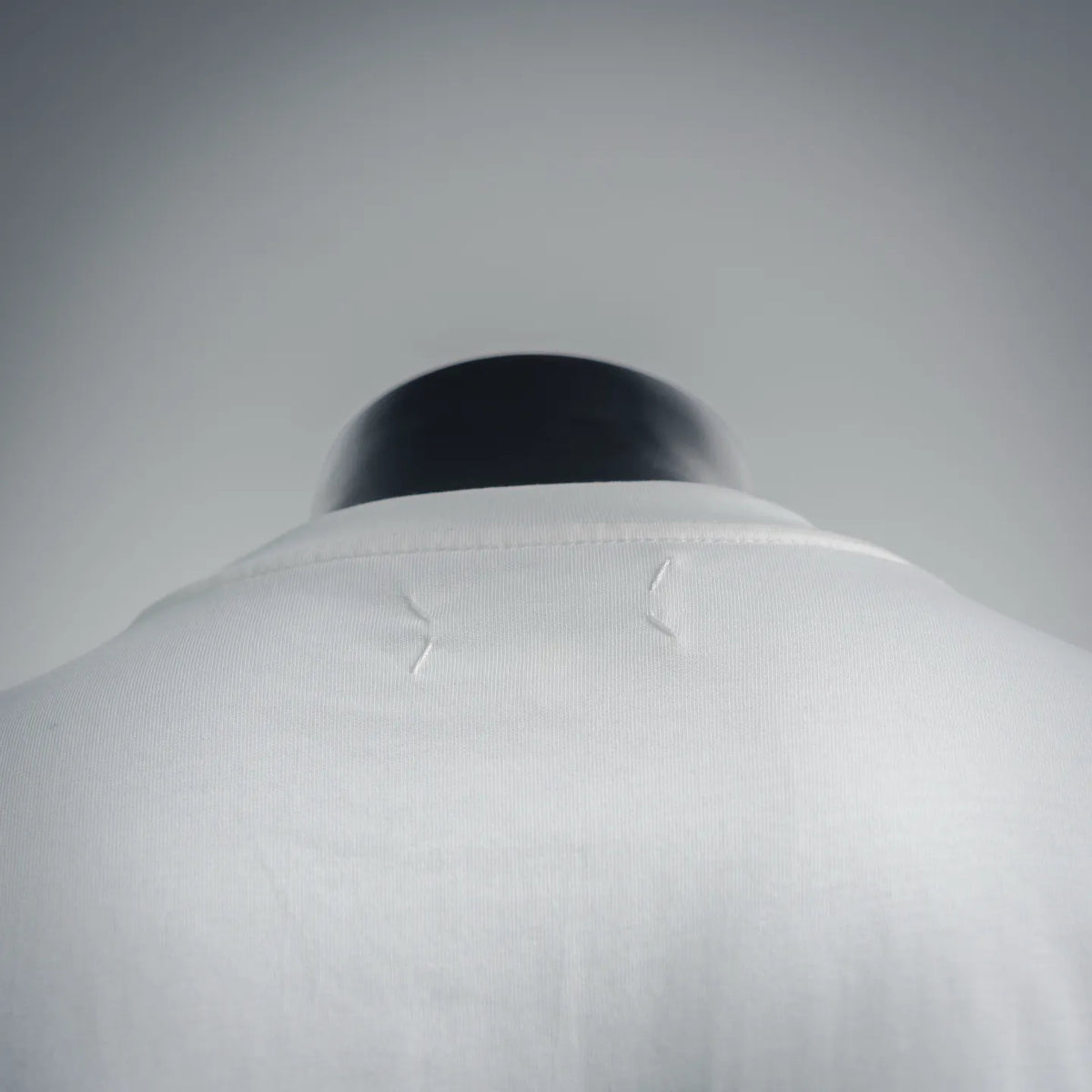 White crew-neck T-shirt back collar seam detail