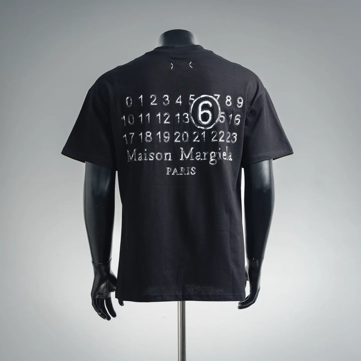 Black short-sleeve t-shirt with large back numeric graphic and centered '6' print