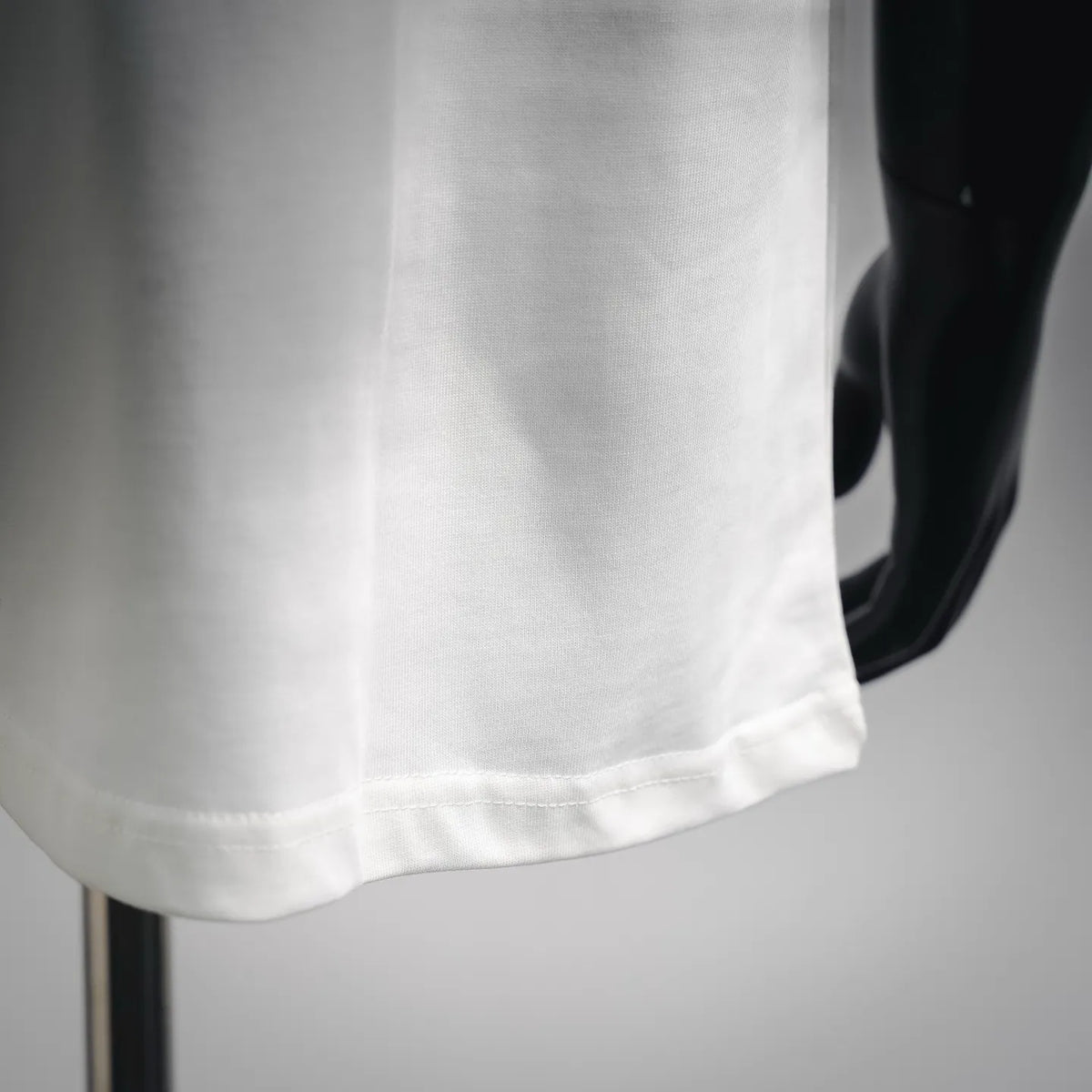 Maison Margiela white T-shirt hem with neat double-stitch seam detail
